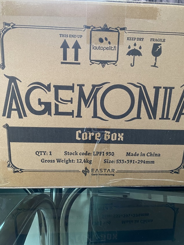 Pale brown box with the text Agemonia on it. 